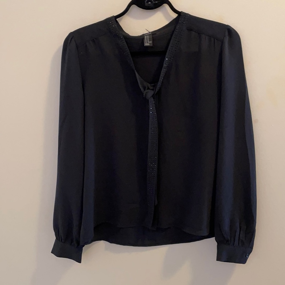 Black blouse with rhinestone neck tie.